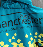 بادگیر مردانه اورجینال Manchester 2002 | کاپشن سبک ضدباد با طراحی مسابقات Commonwealth Games